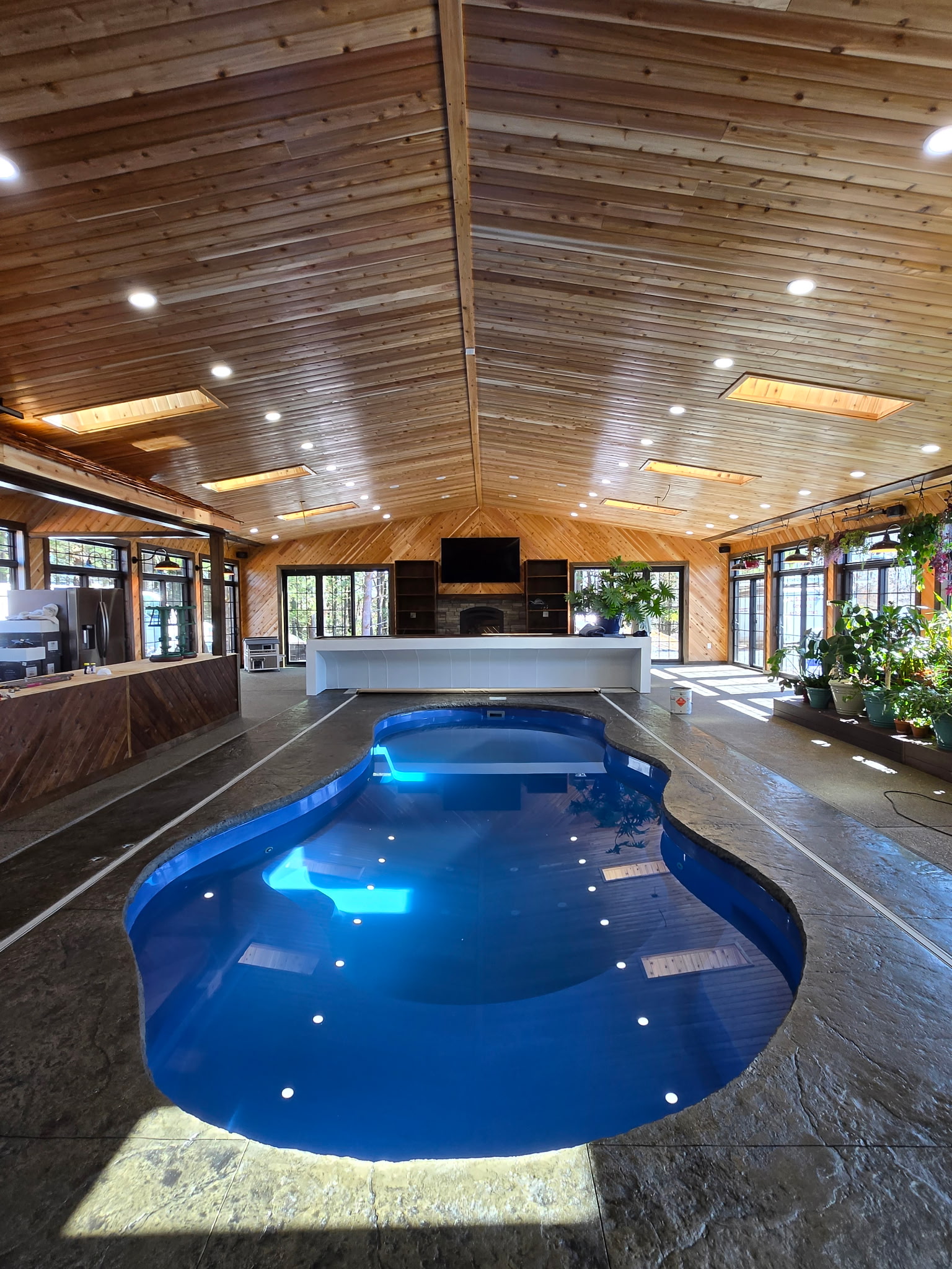Indoor pool project with wood ceiling and custom finish